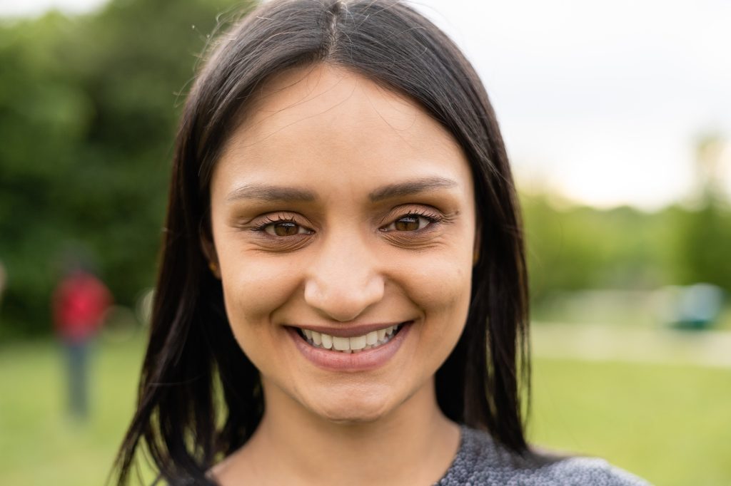 Confident indian girl looking at camera and smiling Confident indian girl looking at camera and smiling